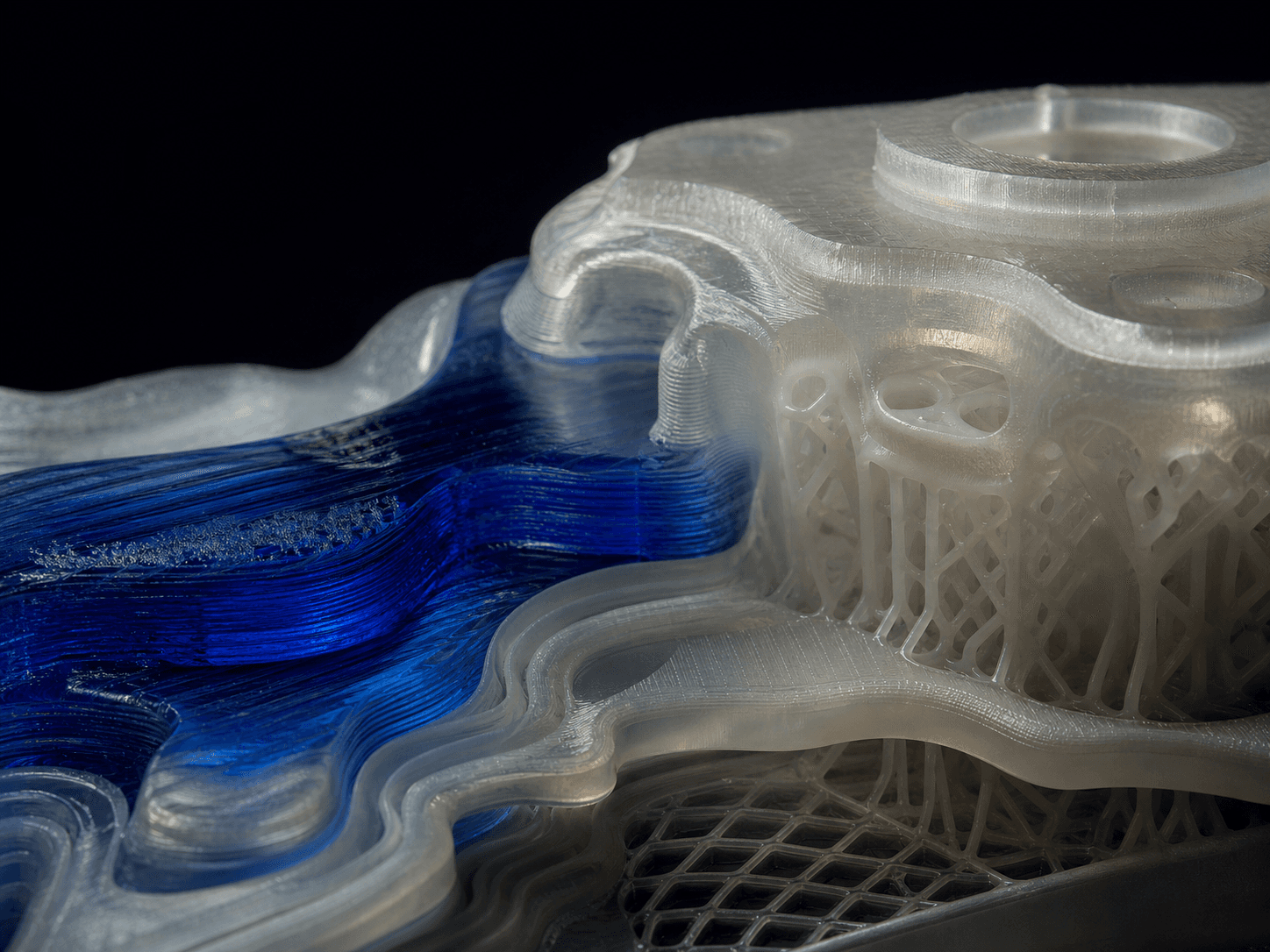 Layered translucent polymer form emerging through additive manufacturing